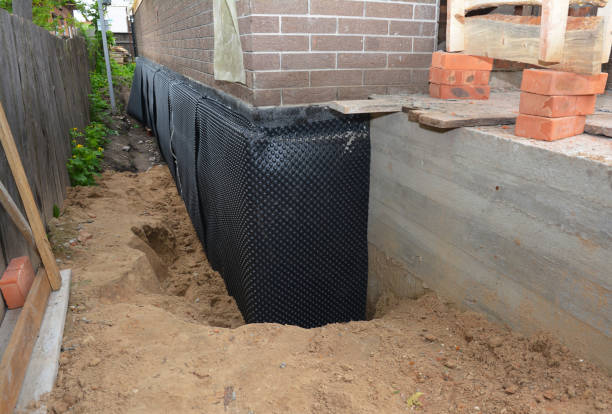 Happy homeowners after waterproofing job in Waterloo